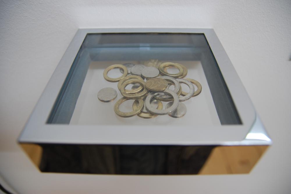 Romanian Trick, 2016. Installation, video, certificate of authenticity, coins. Installation view, Museum of Contemporary Art , Belgrade in cooperation and City Art Gallery Ljubljana_MGML, 2016